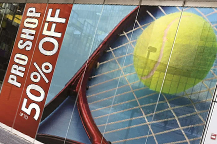 Promotional adhesive vinyl graphics on a storefront window