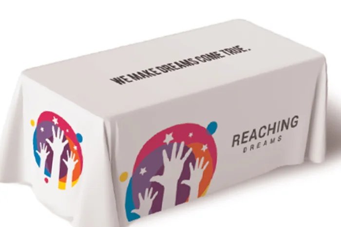 Branded table throw covering an event display table