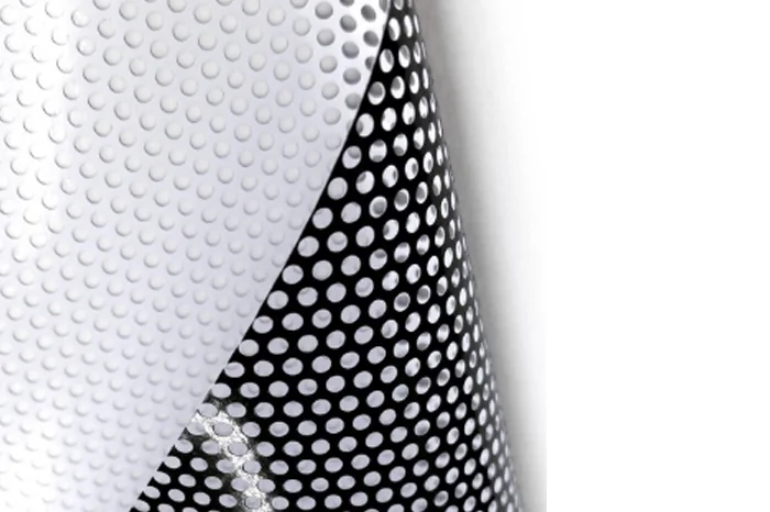 Close-up of perforated window vinyl and its backing