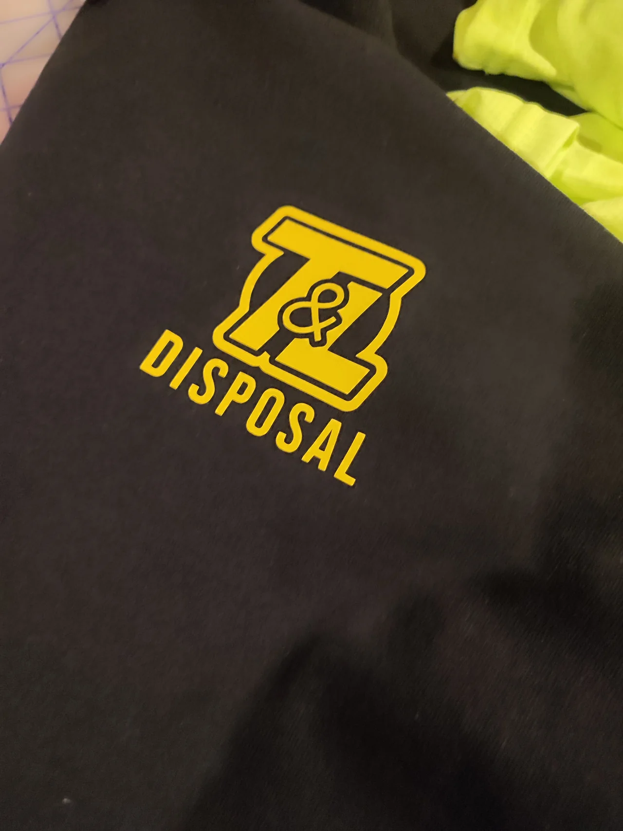 T&L Disposal embroidered shirt logo