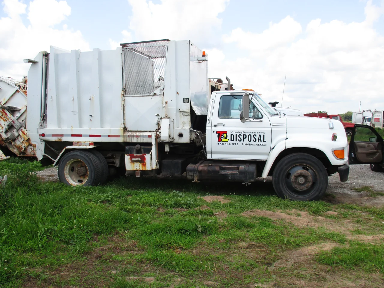 T&L Disposal garbage truck graphics